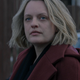 Elisabeth Moss as June Osborne in season four of The Handmaid’s Tale wears a subdued red coat.